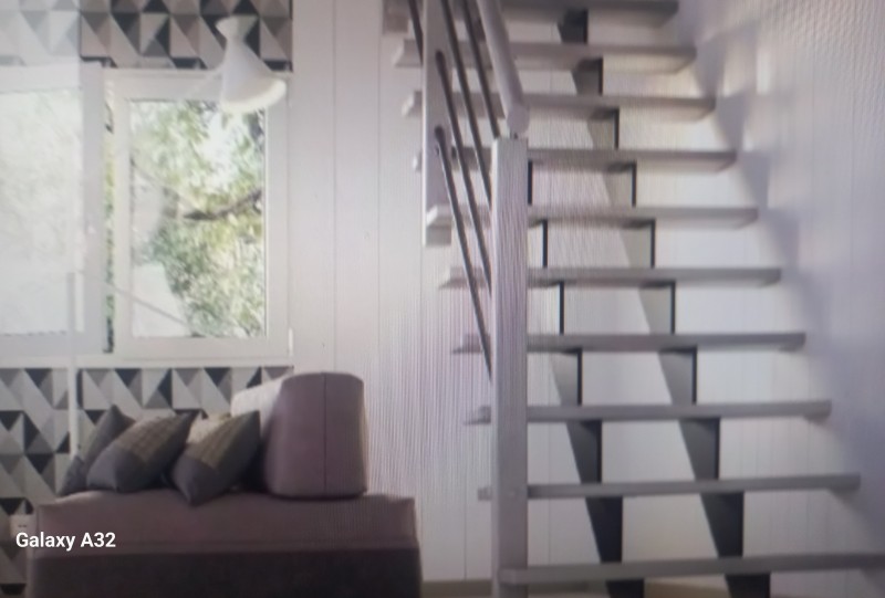 fabrication et pose d'un escalier bois et métal en limon central à Pont-à-Mousson proche de Nancy