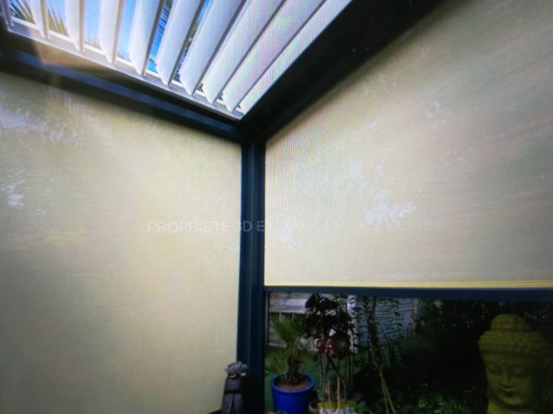 Rénovation et installation d'un ancien store banne par une pergola bioclimatique en aluminium à Niort dans le 79