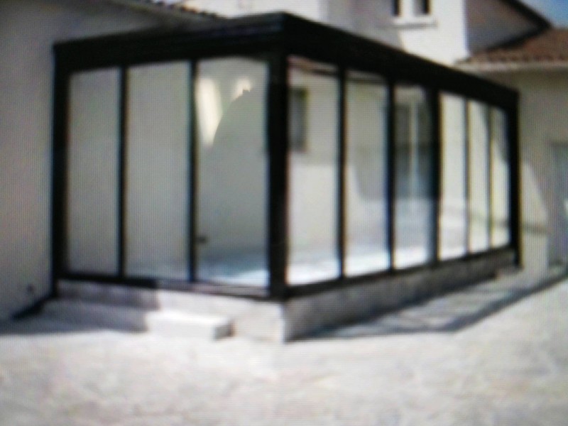 Pose et installation d'une véranda en aluminium sur mesures à Nîmes à côté d'Arles